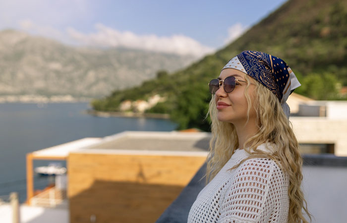 A woman flaunting a bandana and wavy hairstyle