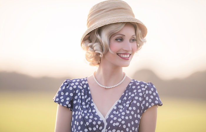 A woman sporting a 1920s curly hairstyle