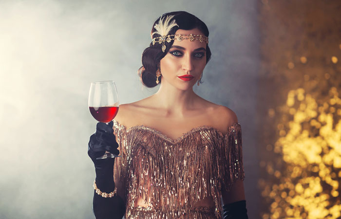 A woman sporting a 1920s hairstyle for long hair with a headband