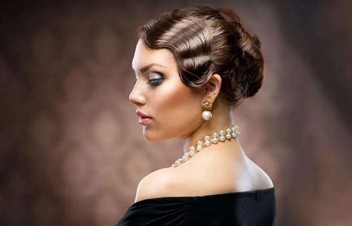 A woman sporting a 1920s updo hairstyle