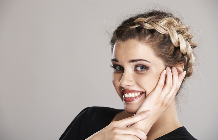 A woman with Dutch crown braid hairstyle for homecoming