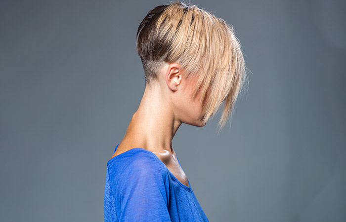 A woman with a fade mushroom haircut