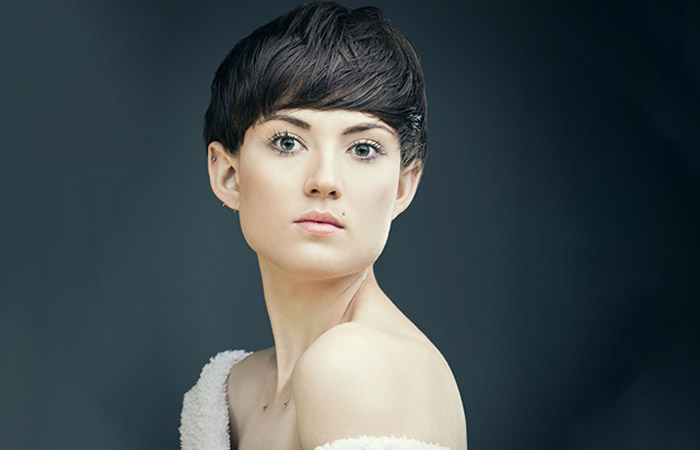 A woman with a long mushroom haircut