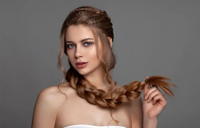 A woman with a loose Dutch braid hairstyle