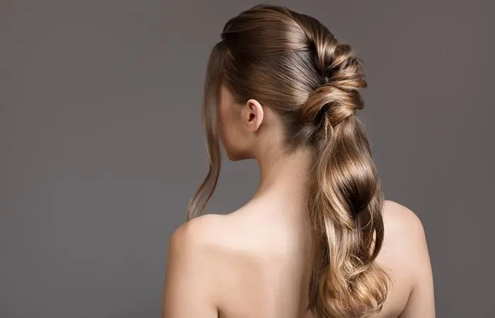 A woman with a trendy twist ponytail hairstyle