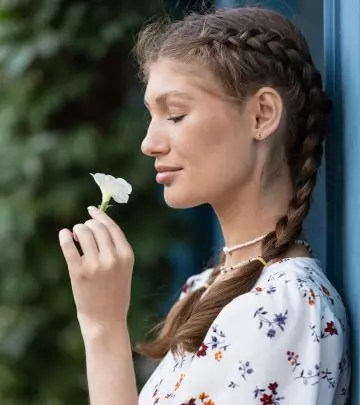 A woman with braided pigtails