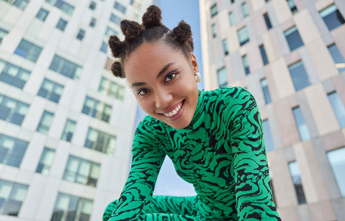 A woman with natural hair rubber band hairstyle