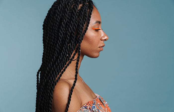 A woman with twist braids hairstyle