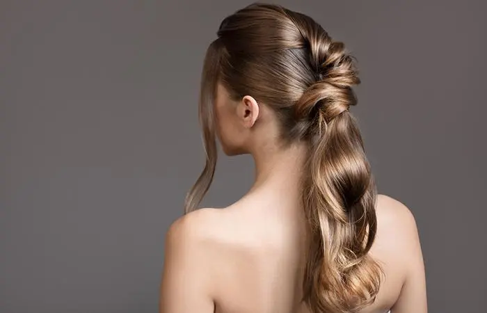 A woman with twisted ponytail hairstyle for homecoming