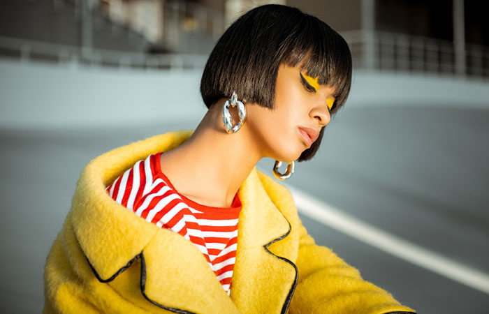 An African American woman sporting a 1920s hairstyle