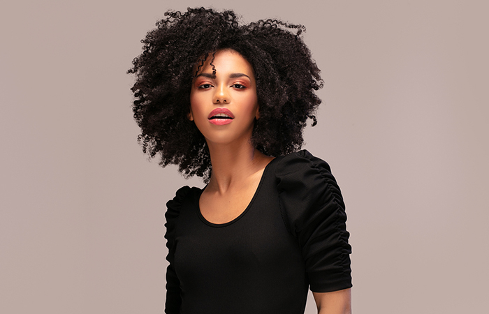 An African-American woman with a curly hairstyle