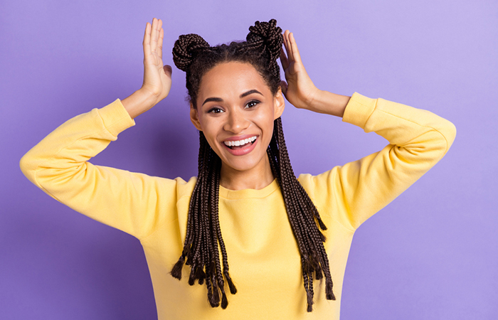 An afro space bun and pigtails