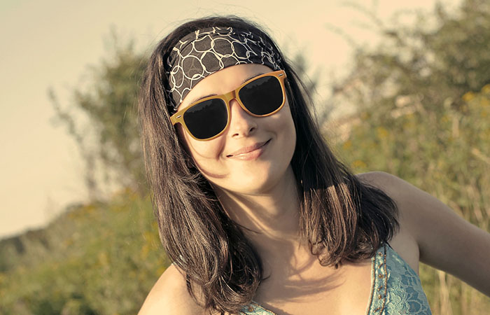 A woman with a bandana biker girl hairstyle