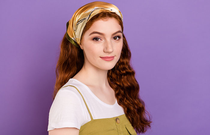 A woman with long hair bandana hairstyle