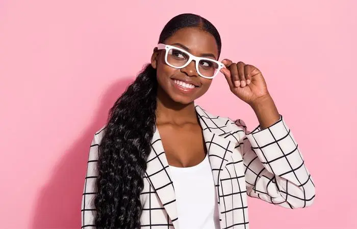 A woman sporting a weave ponytail hairstyle