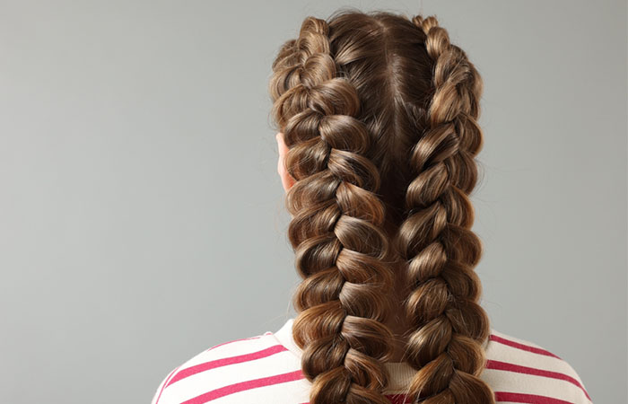 A girl flaunting long bubble braids