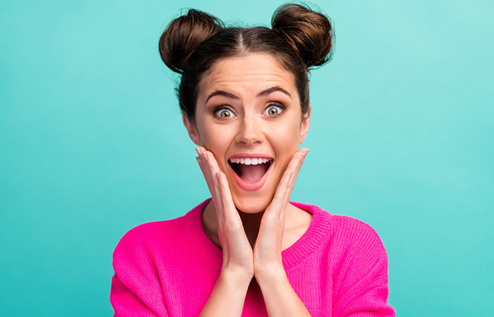 Woman with a preppy space bun hairstyle for mid-length hair