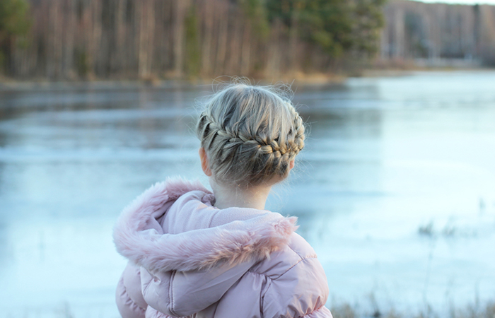 A woman with a milkmaid braid hairstyle