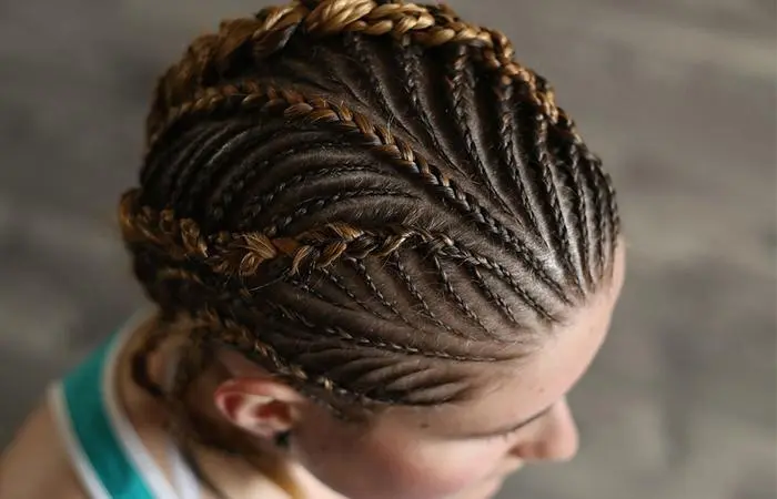 A close up shot of a braid hairstyle woven along the scalp