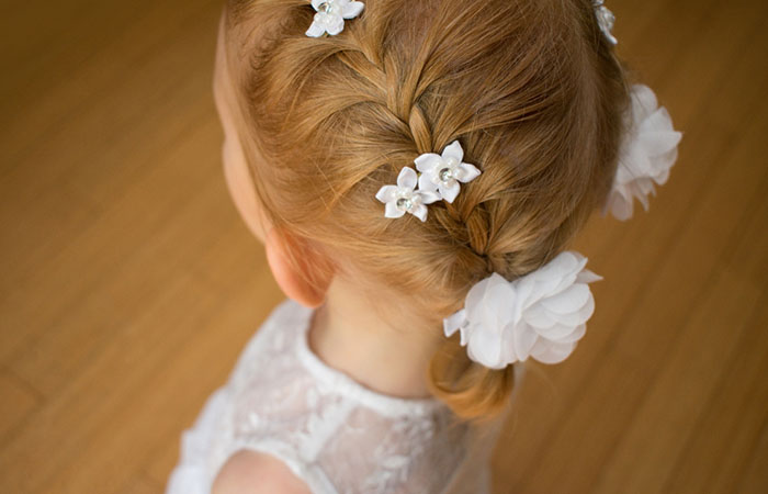 A kid with short hair flower girl hairstyle