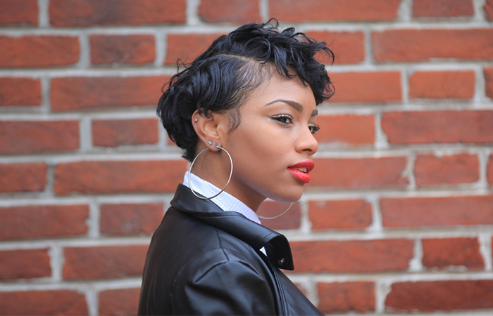 A woman wearing a short layered bob weave