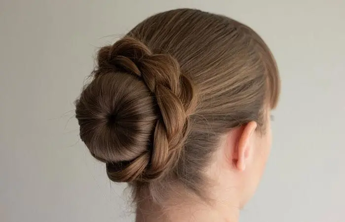 Woman with a braided bun volleyball hairstyle