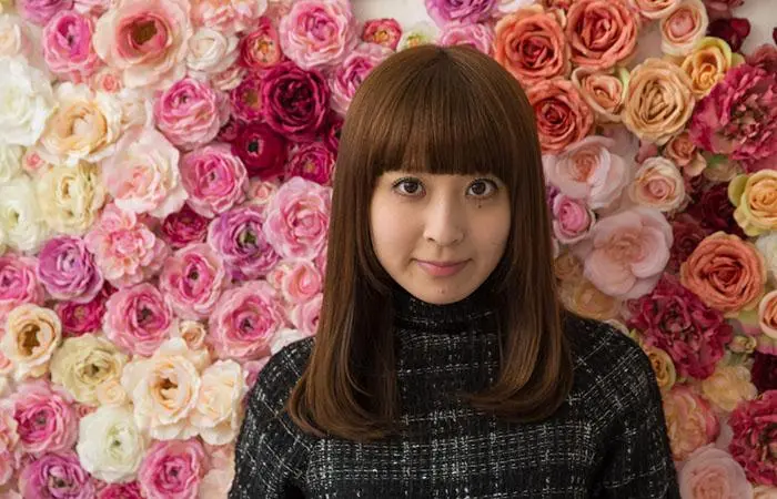 Woman with a feminine long pageboy haircut