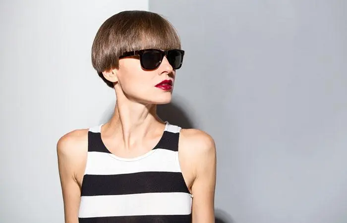 Woman with a sharp pixie pageboy haircut