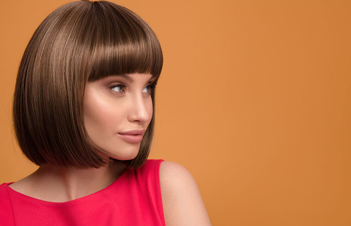 Woman with a voluminous 1960s pageboy haircut