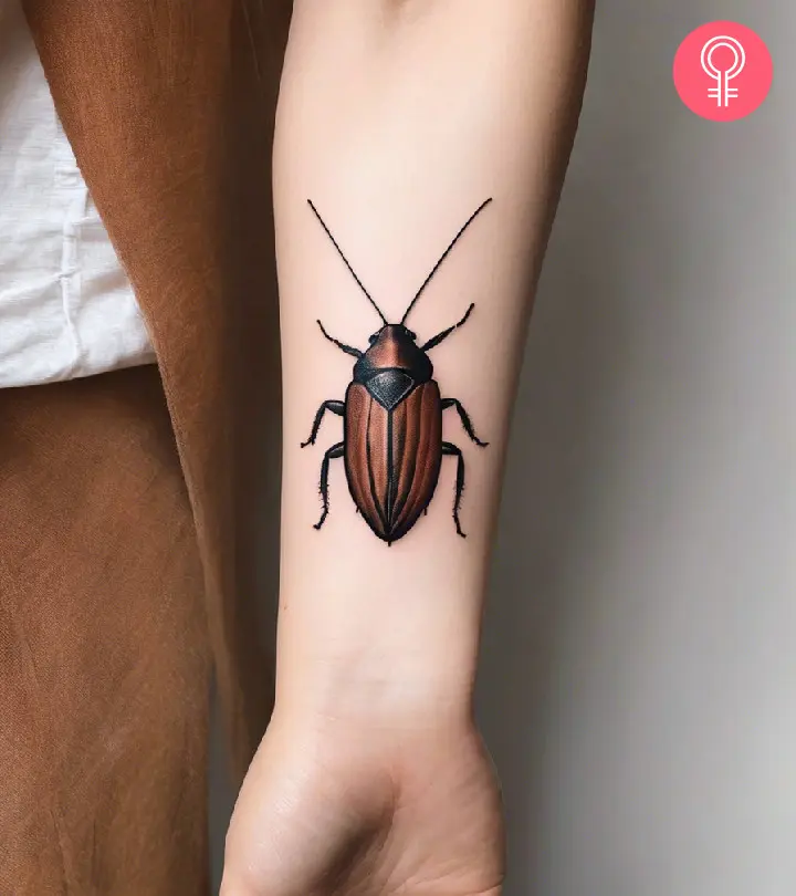 Cockroach tattoo on the forearm