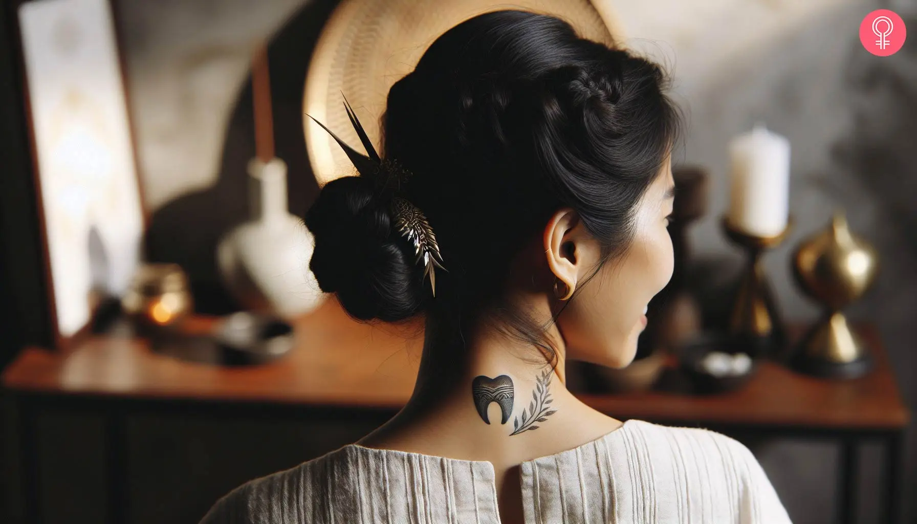 A black ink tooth tattoo with intricate patterns on the back of the neck