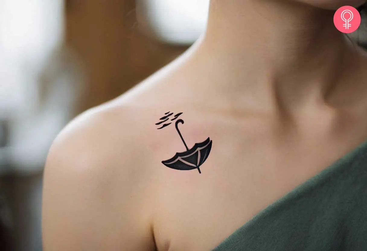 A silhouette tattoo of an upside down umbrella