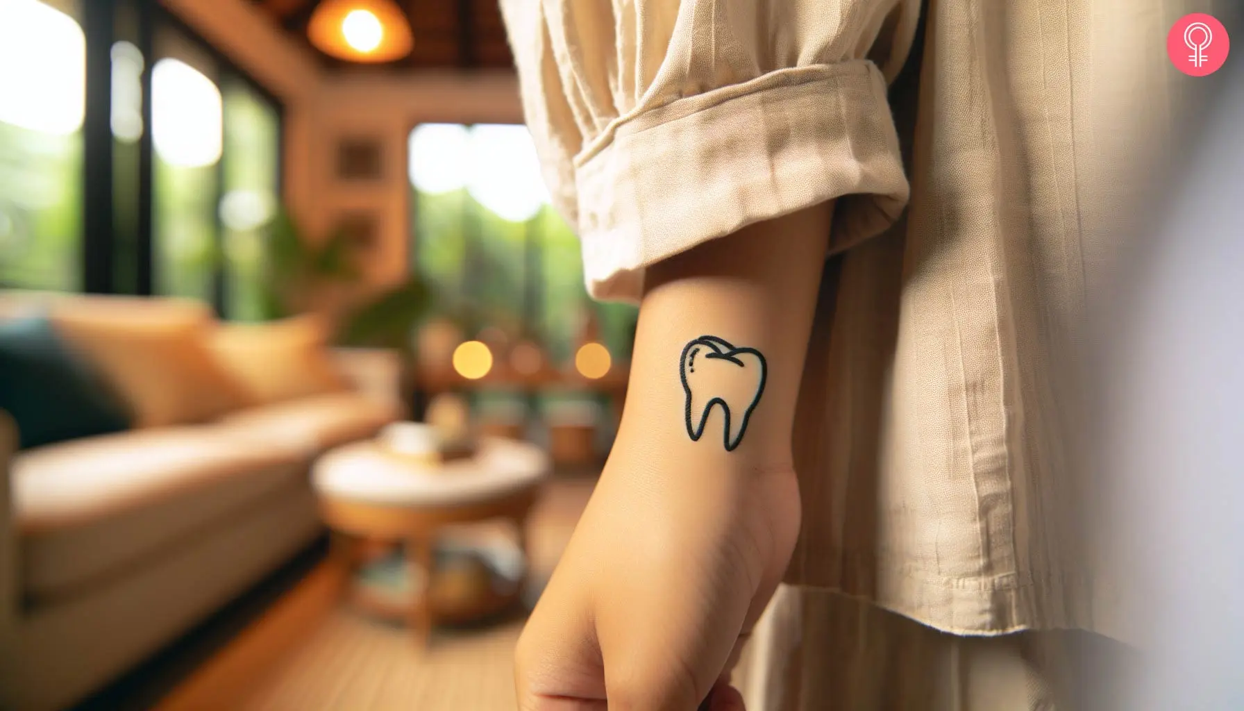 A simple tooth tattoo design on the side of the wrist