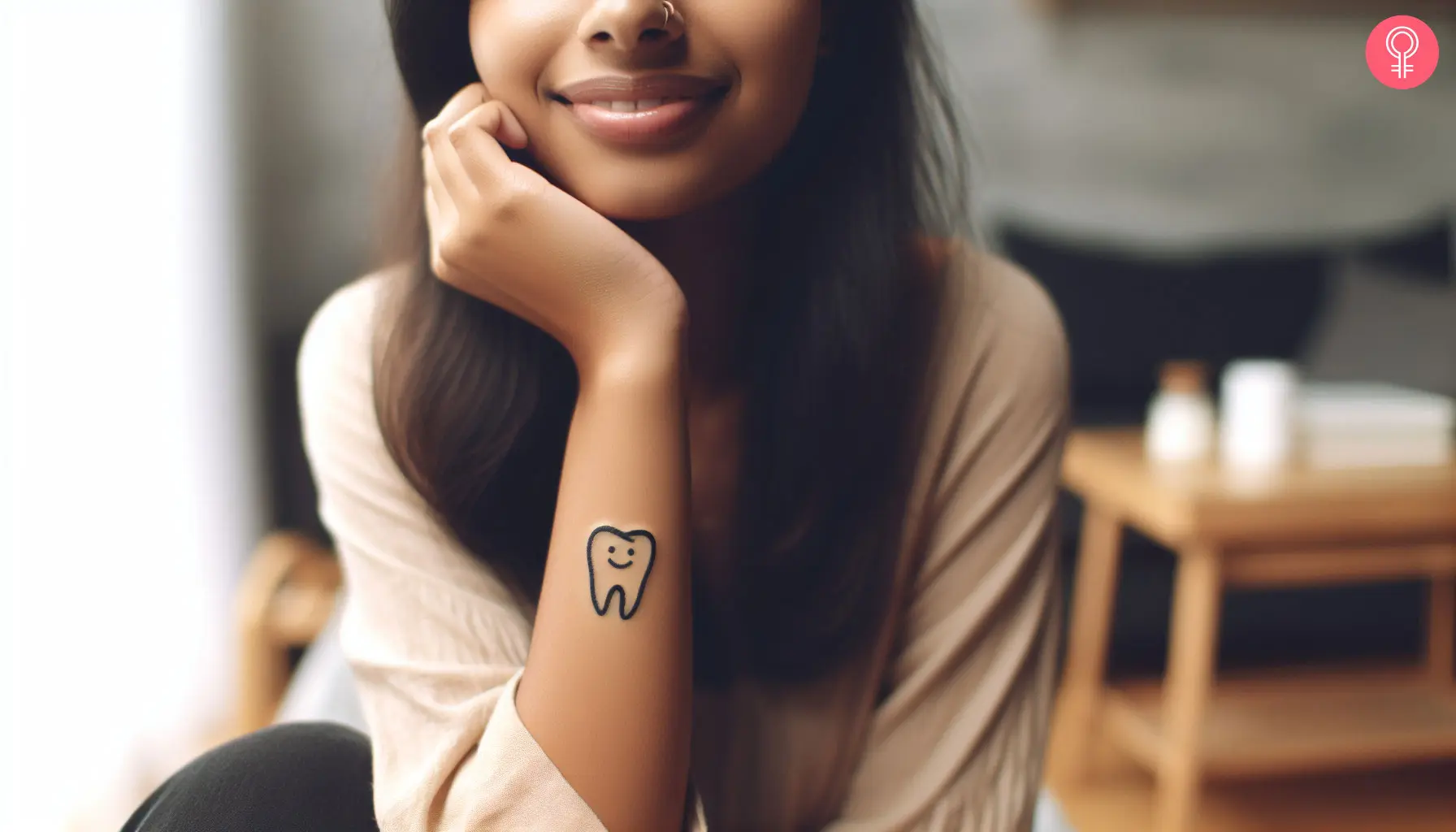 A small and cute tooth tattoo with a smiley face