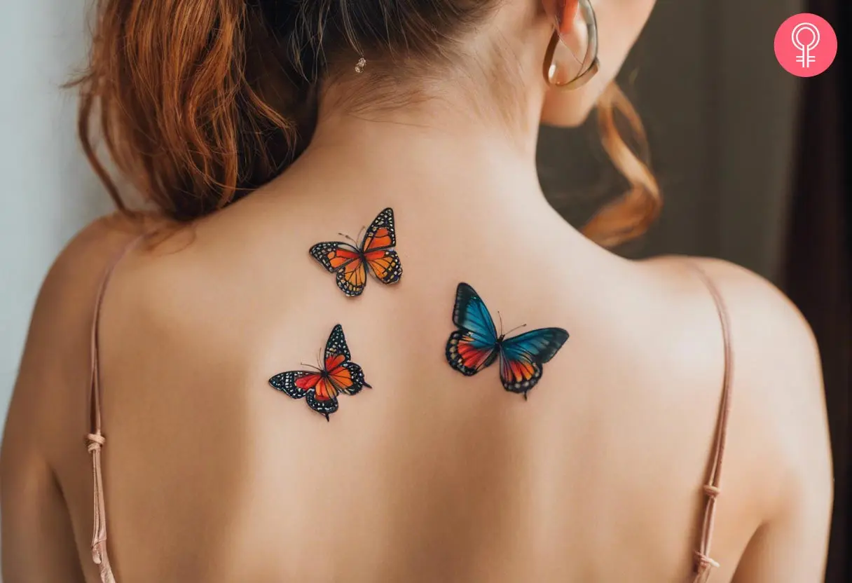 A woman flaunting a Y2K butterfly tattoo on her back