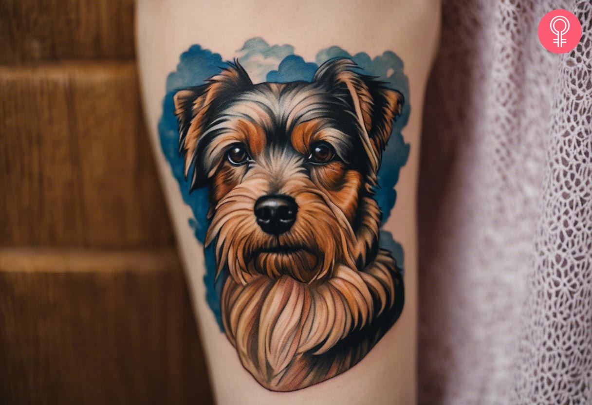 A woman with a Yorkshire terrier tattoo on her arm