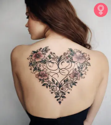 A y2k heart tattoo on a woman’s back