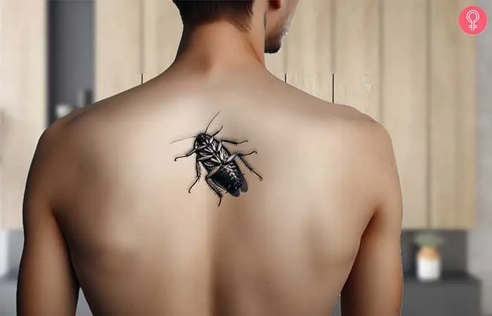 Man with a hurt cockroach tattoo on the back