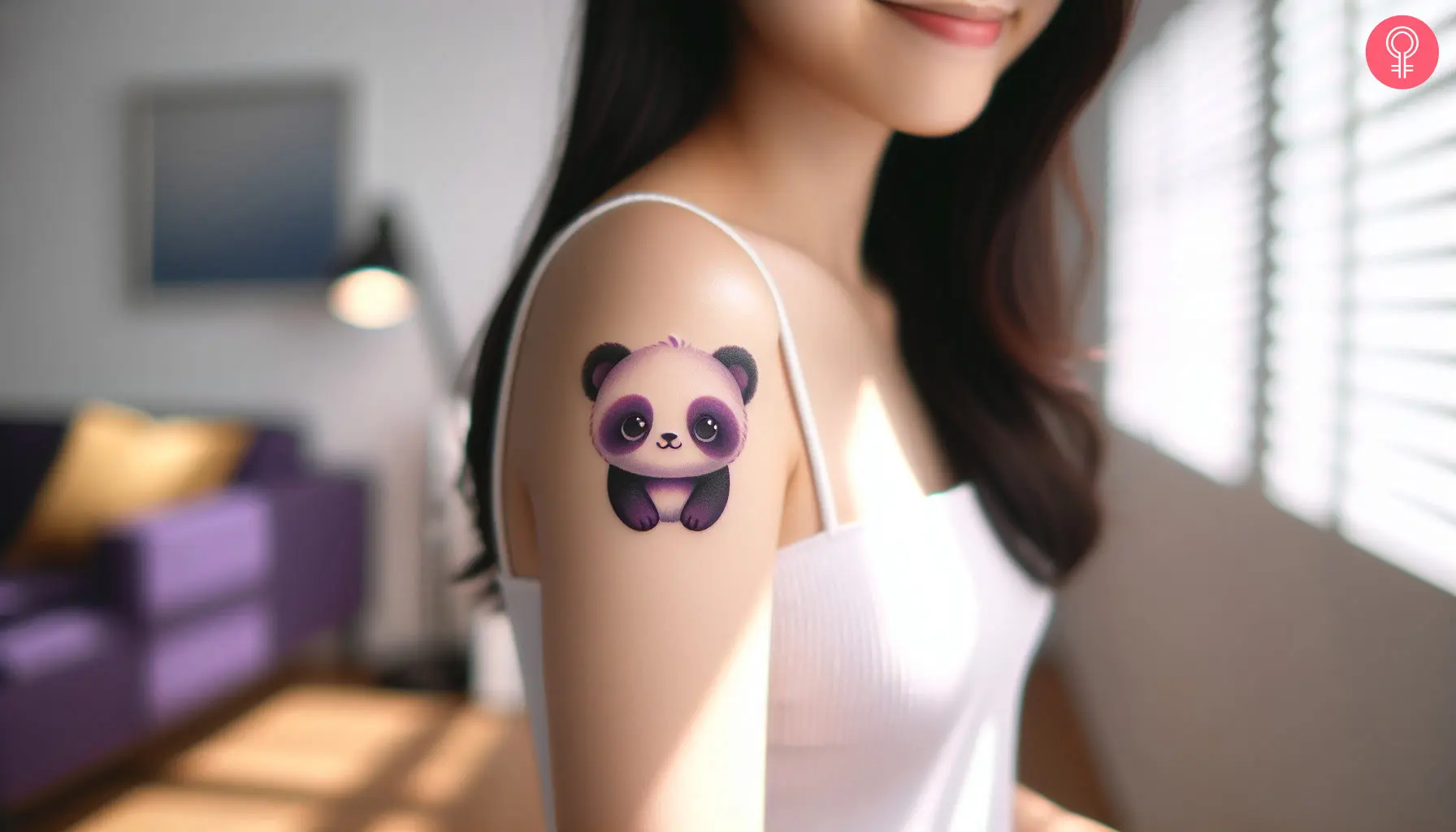 A woman wearing a Kawaii panda tattoo on the upper arm.