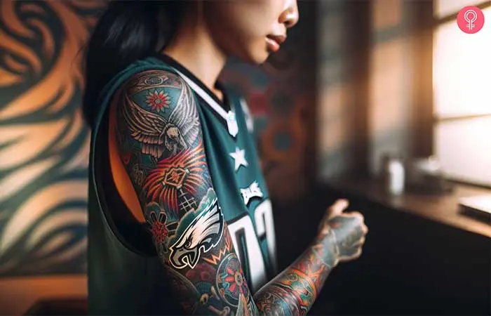 A woman with a Philadelphia Eagles logo tattoo on her arm