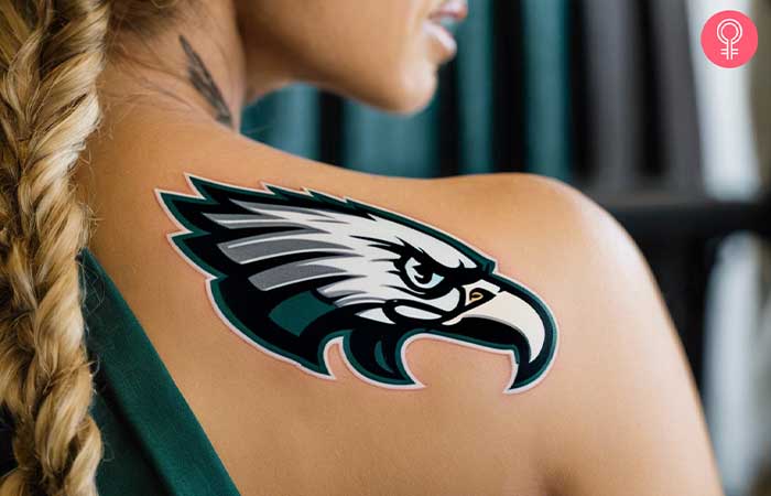 A woman with a Philadelphia Eagles logo tattoo on her shoulder