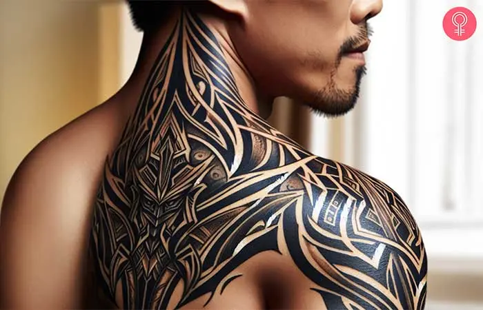 A man with a warrior tribal shoulder tattoo.