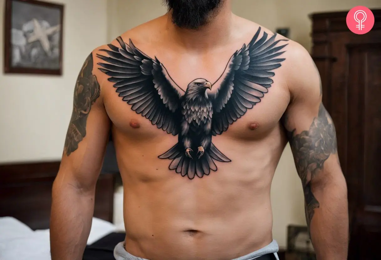 A black and gray bald eagle chest tattoo