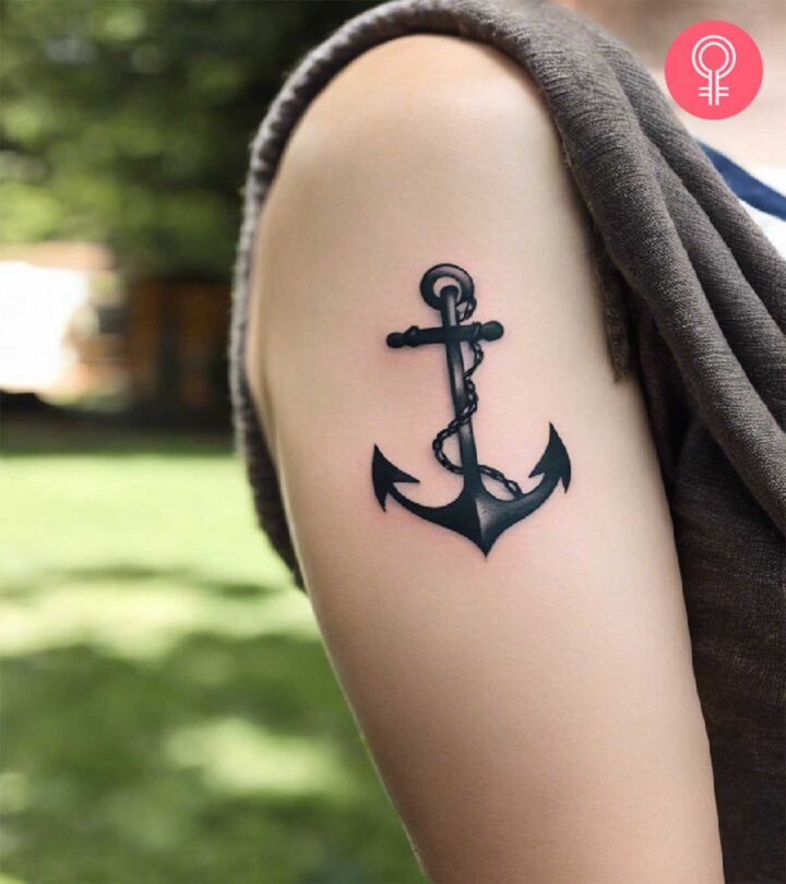 8 Symbolic Strength Tattoo Ideas To Explore A black and white anchor tattoo on the upper arm