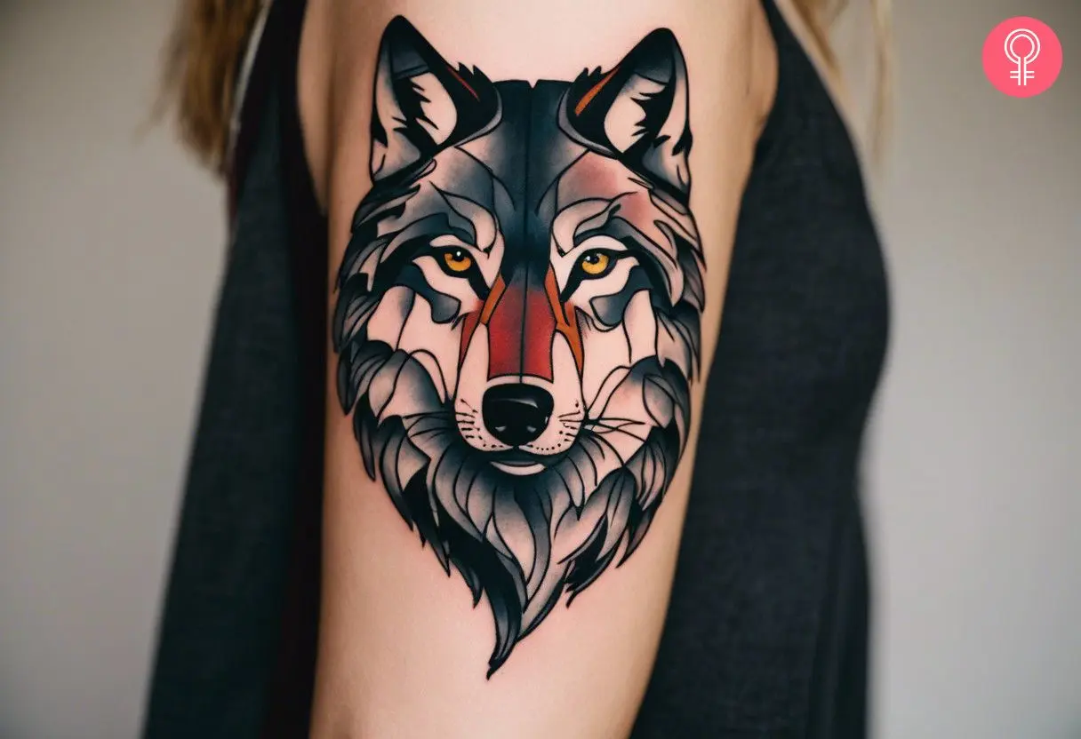 A woman with an angry lone wolf tattoo on her bicep