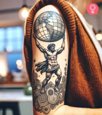 Atlas with the globe tattoo on the upper arm