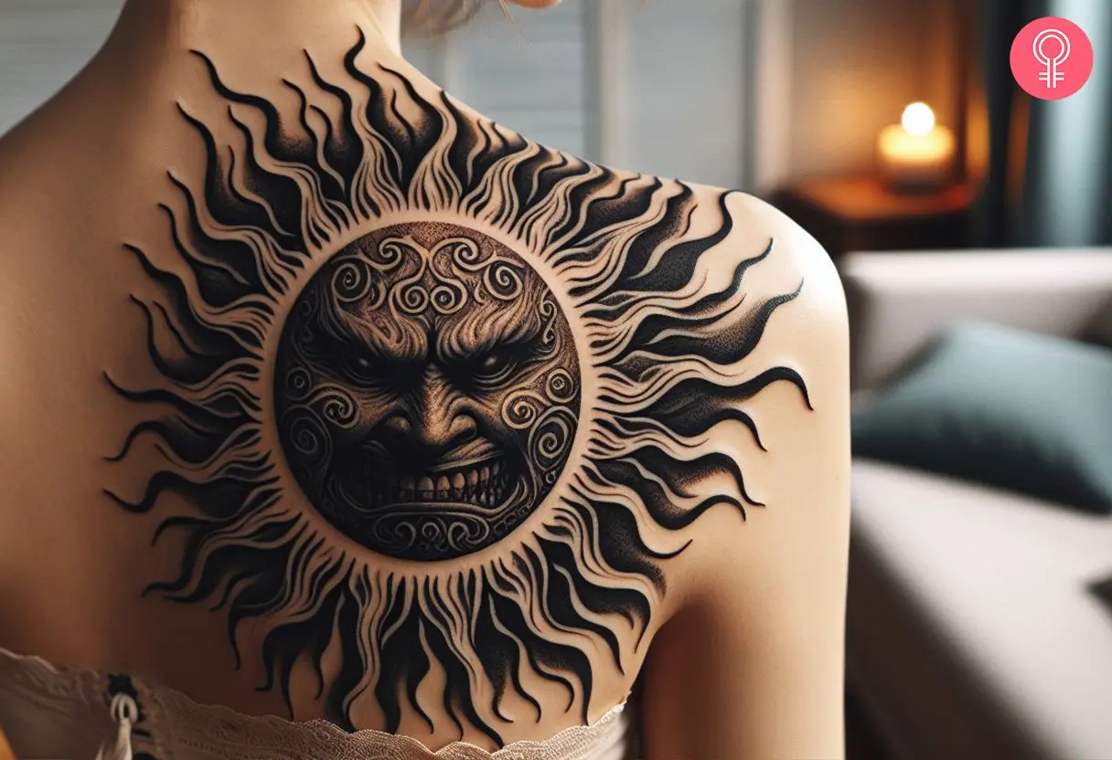 Evil face black sun tattoo on the back shoulder