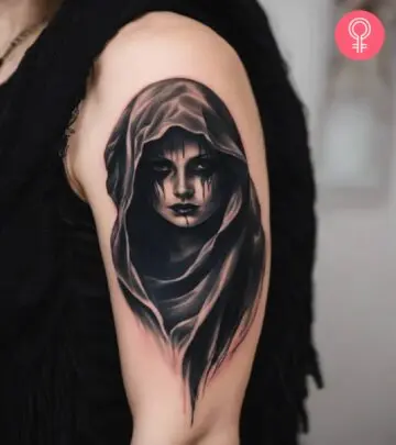 Ghost face dark tattoo on the upper arm