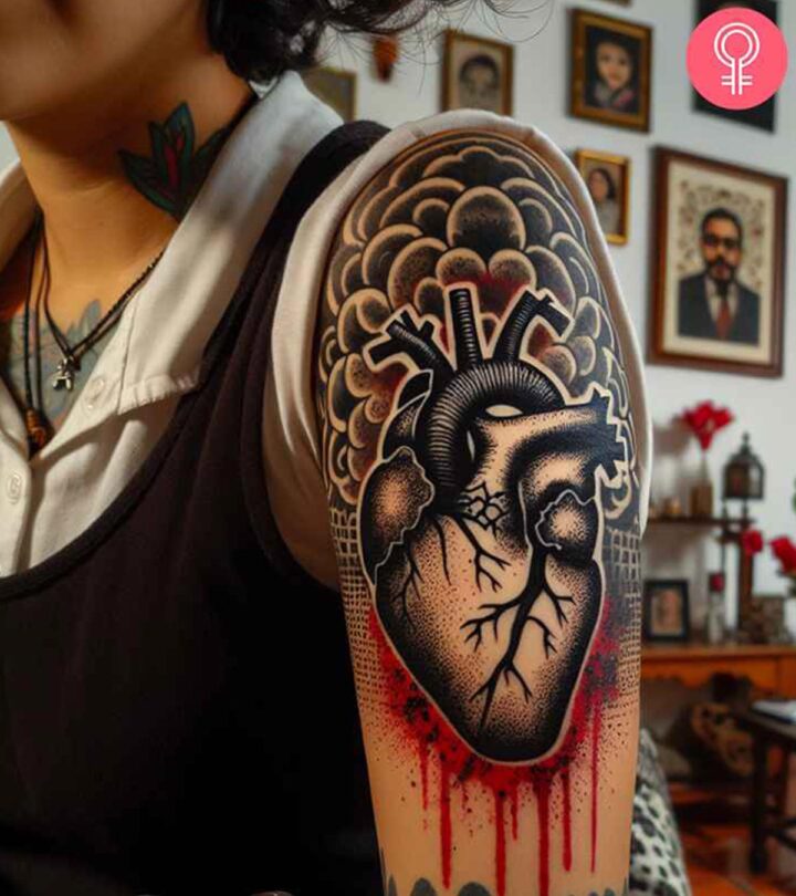 8 Stunning Bleeding Heart Tattoo Designs With Their Meanings A woman with a black bleeding heart tattoo