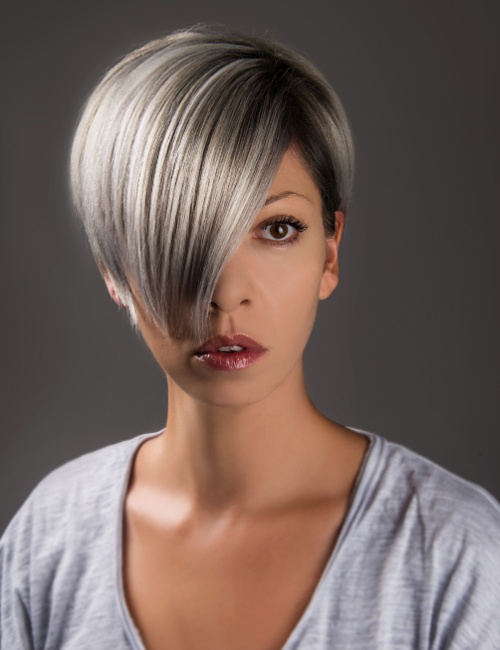 A woman sporting an asymmetric pixie